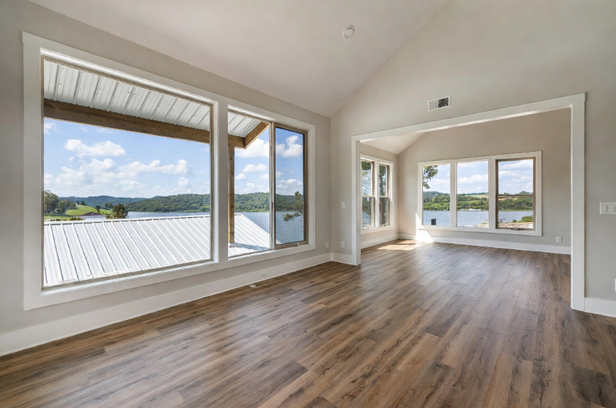 Spacious open-concept interior of a Grayson County KY lakeside home showcasing 2026 lvp flooring installation