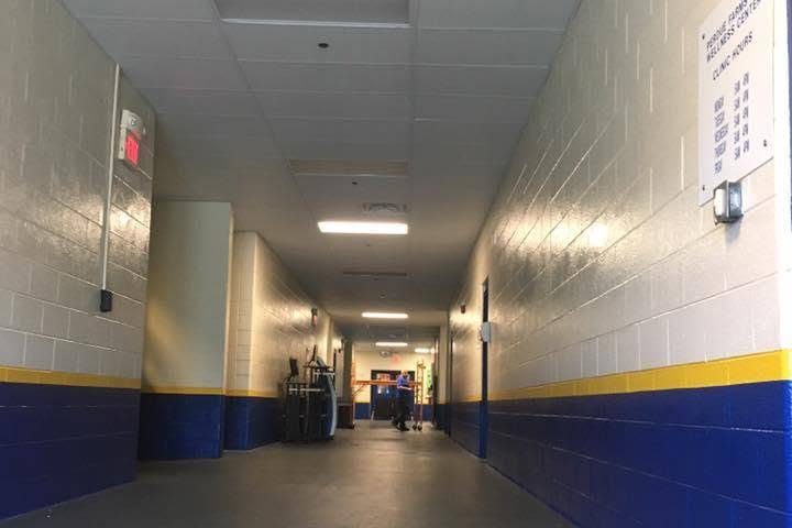 Long commercial hallway with a new acoustical drop ceiling and painted block walls — Leitchfield, Kentucky
